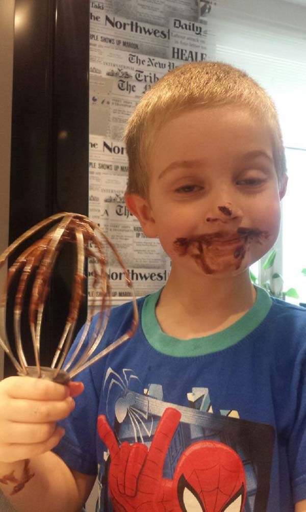 funny child with chocolate on face