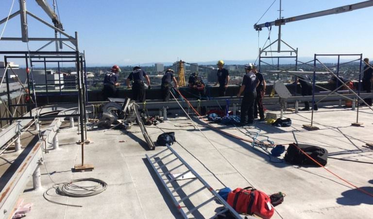 Firefighters Rescue Workers Trapped On Scaffolding